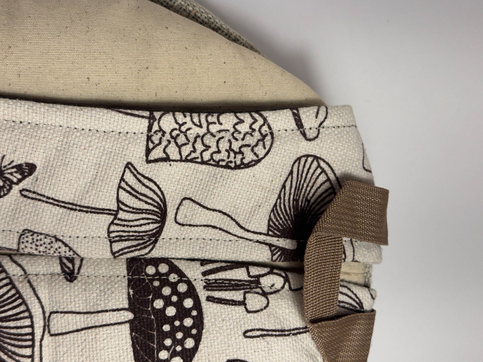Cream canvas backpack hand block printed with mushrooms, view 9