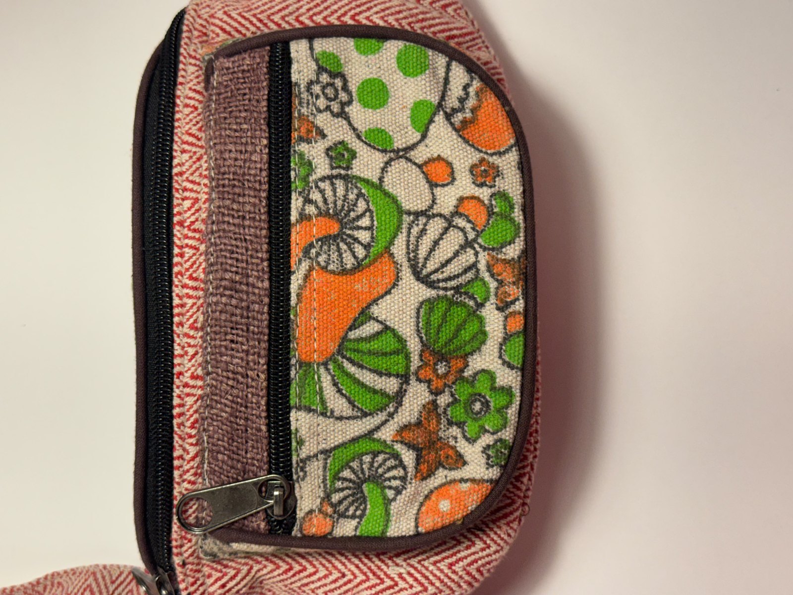 Coral herringbone hemp fanny pack with floral cotton lining, view 1