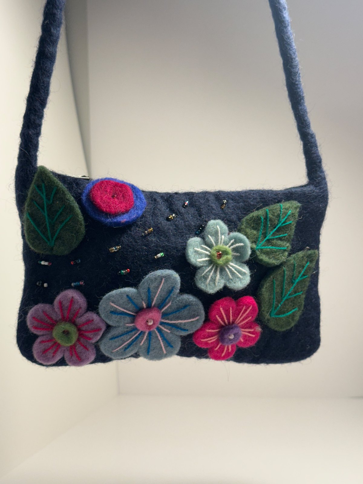 Navy wool felt shoulder bag with hand stitched felt flowers, view 2