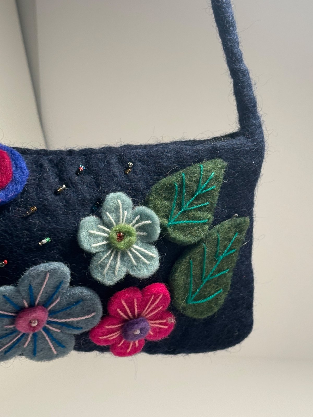 Navy wool felt shoulder bag with hand stitched felt flowers, view 5