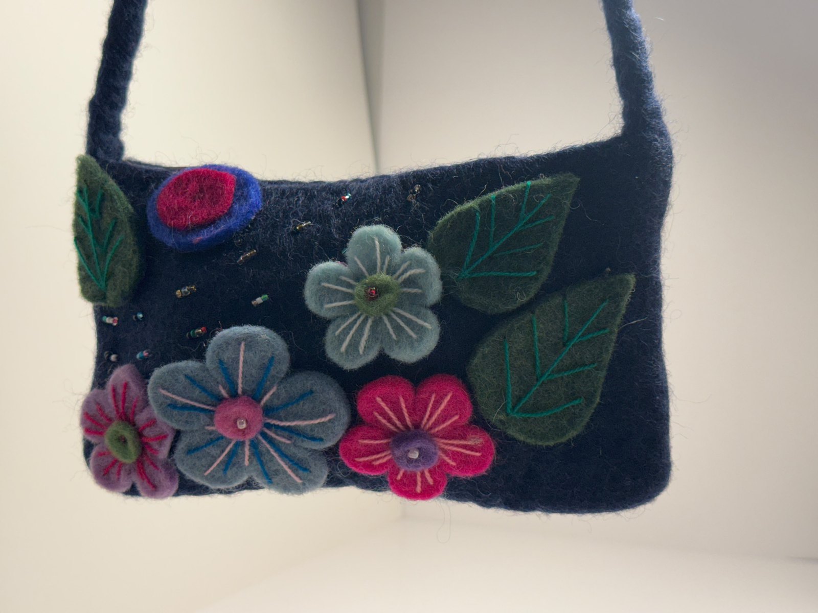 Navy wool felt shoulder bag with hand stitched felt flowers, view 8