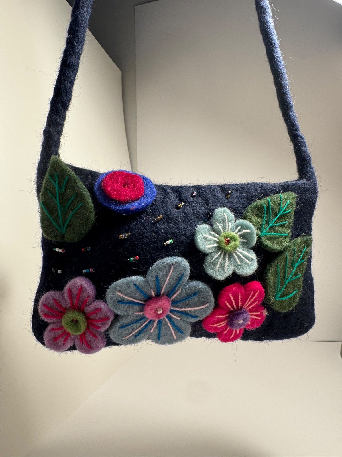 Navy wool felt shoulder bag with hand stitched felt flowers, view 9