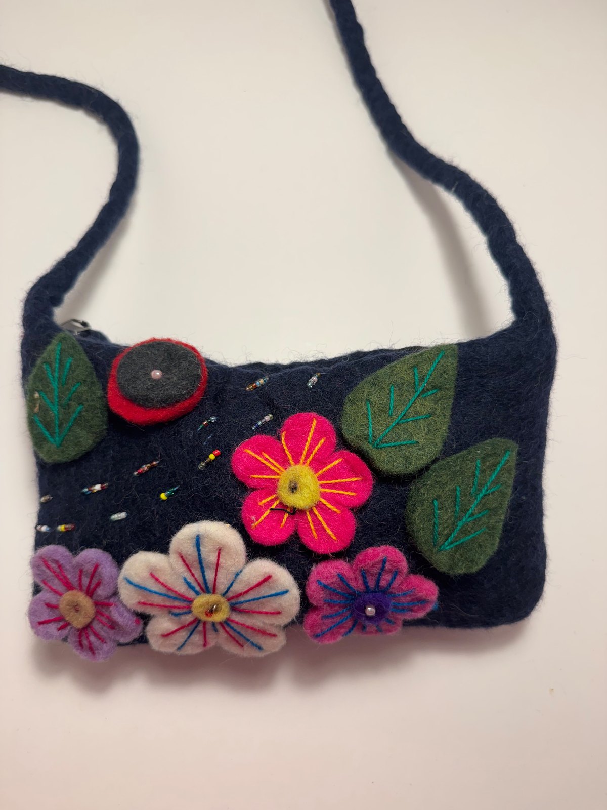 Navy wool felt shoulder bag with hand stitched felt flowers, view 11