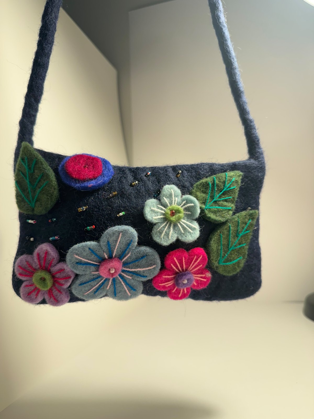 Navy wool felt shoulder bag with hand stitched felt flowers, view 12