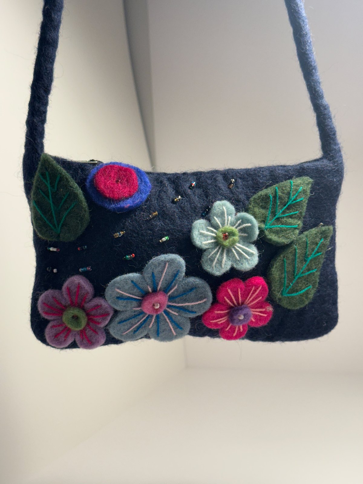 Navy wool felt shoulder bag with hand stitched felt flowers, view 14