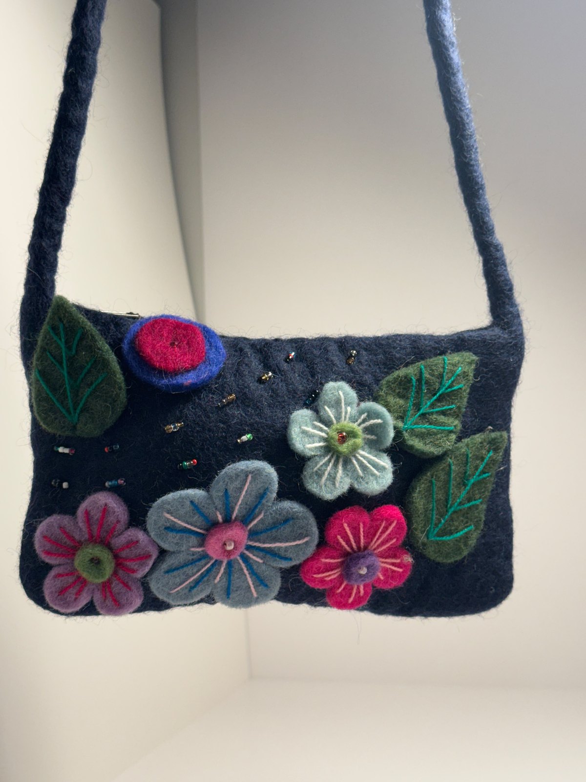 Navy wool felt shoulder bag with hand stitched felt flowers, view 15